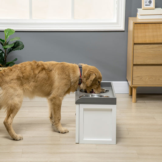 A large dog eating from the raised dog bowls unit, which is white with a grey top