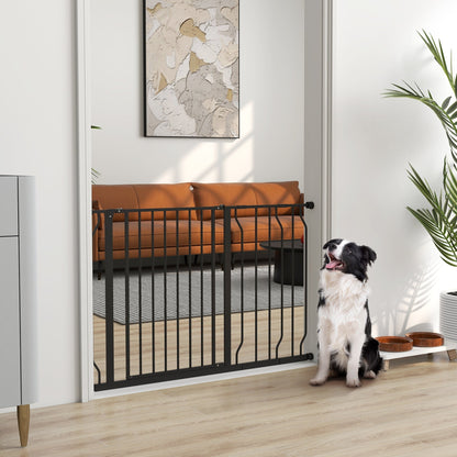 The dog gate installed in a doorway with a dog sitting on the floor nearby