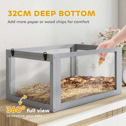 The deep bottom of the hamster cage, filled with bedding, with a hand adding more