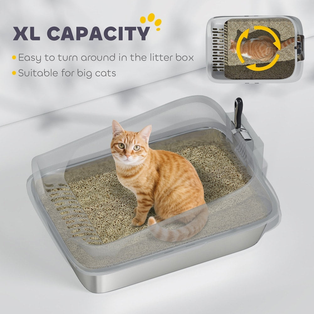 An orange cat sits inside the large stainless steel cat litter box with a clear lid