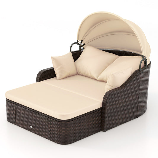 PE Rattan Daybed with retractable canopy and soft cushions in brown, shown from the front with canopy up