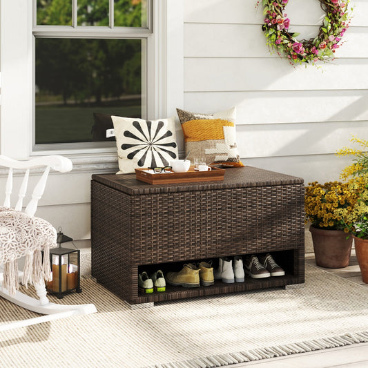 The outdoor storage box placed on a porch with cushions on top and shoes stored in the bottom shelf