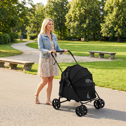 The dog stroller with the canopy closed being pushed by a woman along a path