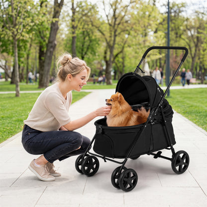 The dog stroller with a small dog inside being petted by a woman in a park