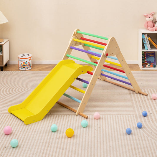 The climbing frame with a slide set up in a child's bedroom with scattered colourful balls