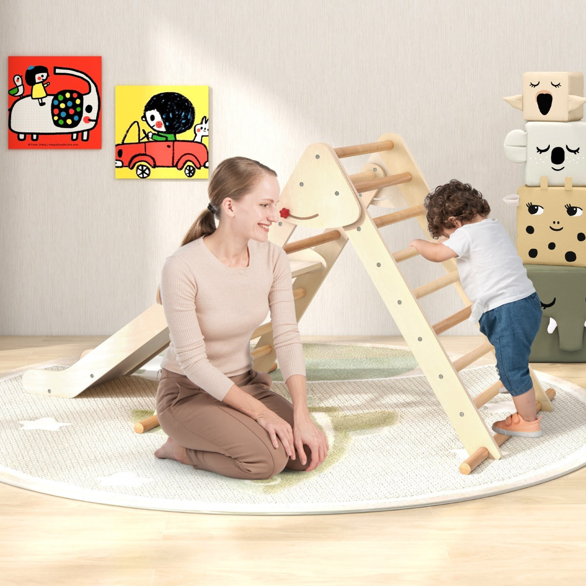 A mother and child interacting with the natural wood climbing frame with slide indoors