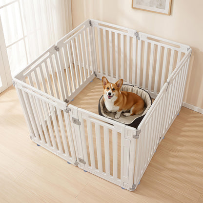 The white pet gate is set up in a room with a corgi dog sitting in a bed inside
