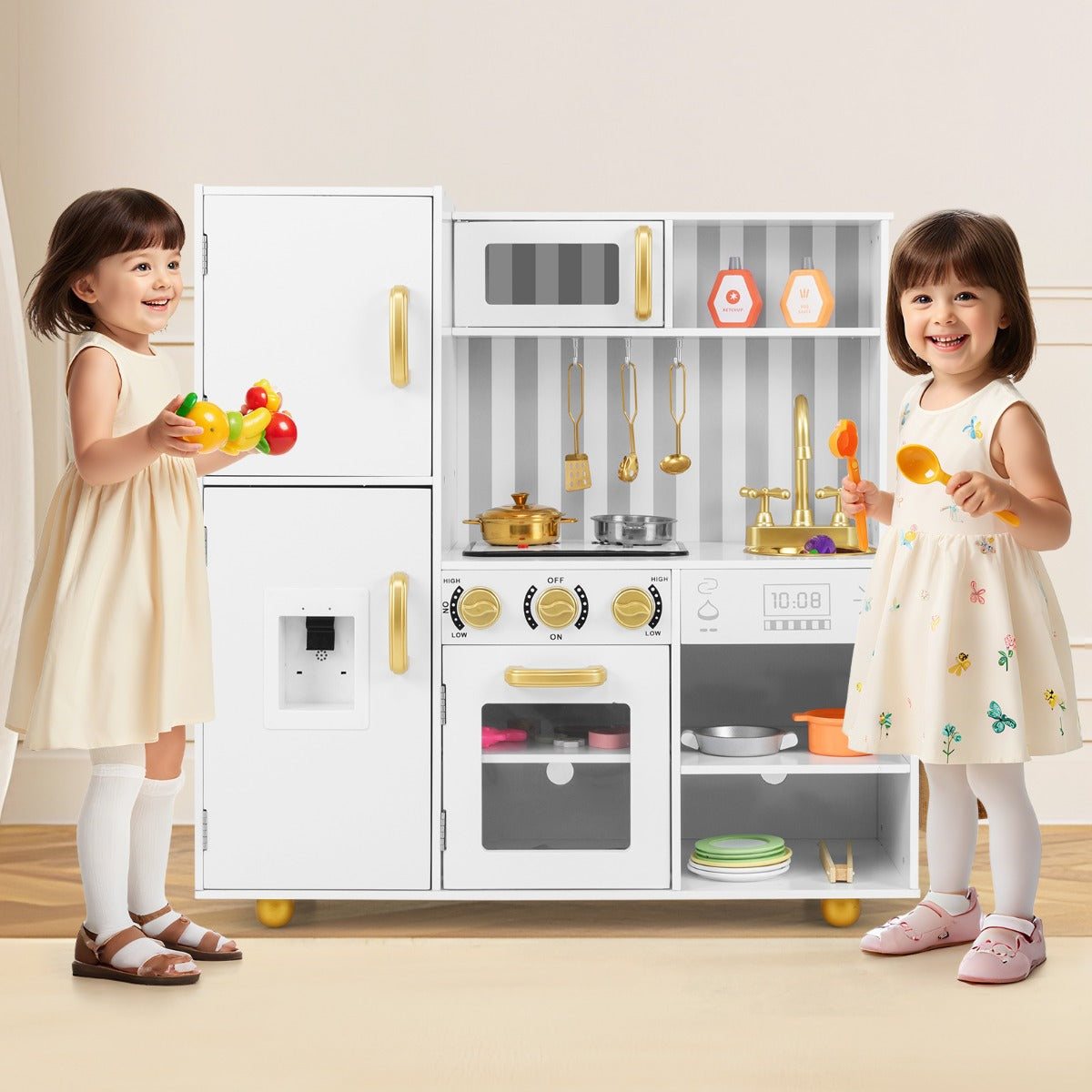 Two children playing with the white and golden play kitchen set