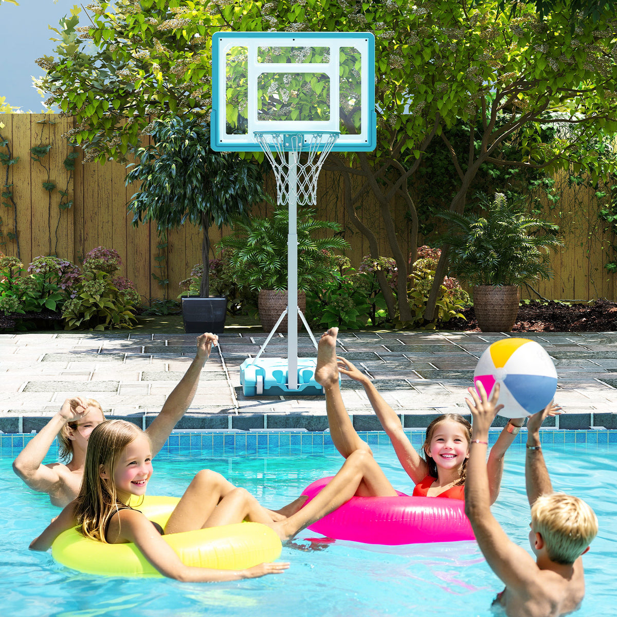 A family plays with the poolside basketball goal in a swimming pool