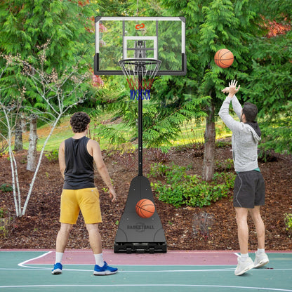 The sport equipment being used by two people playing basketball on an outdoor court