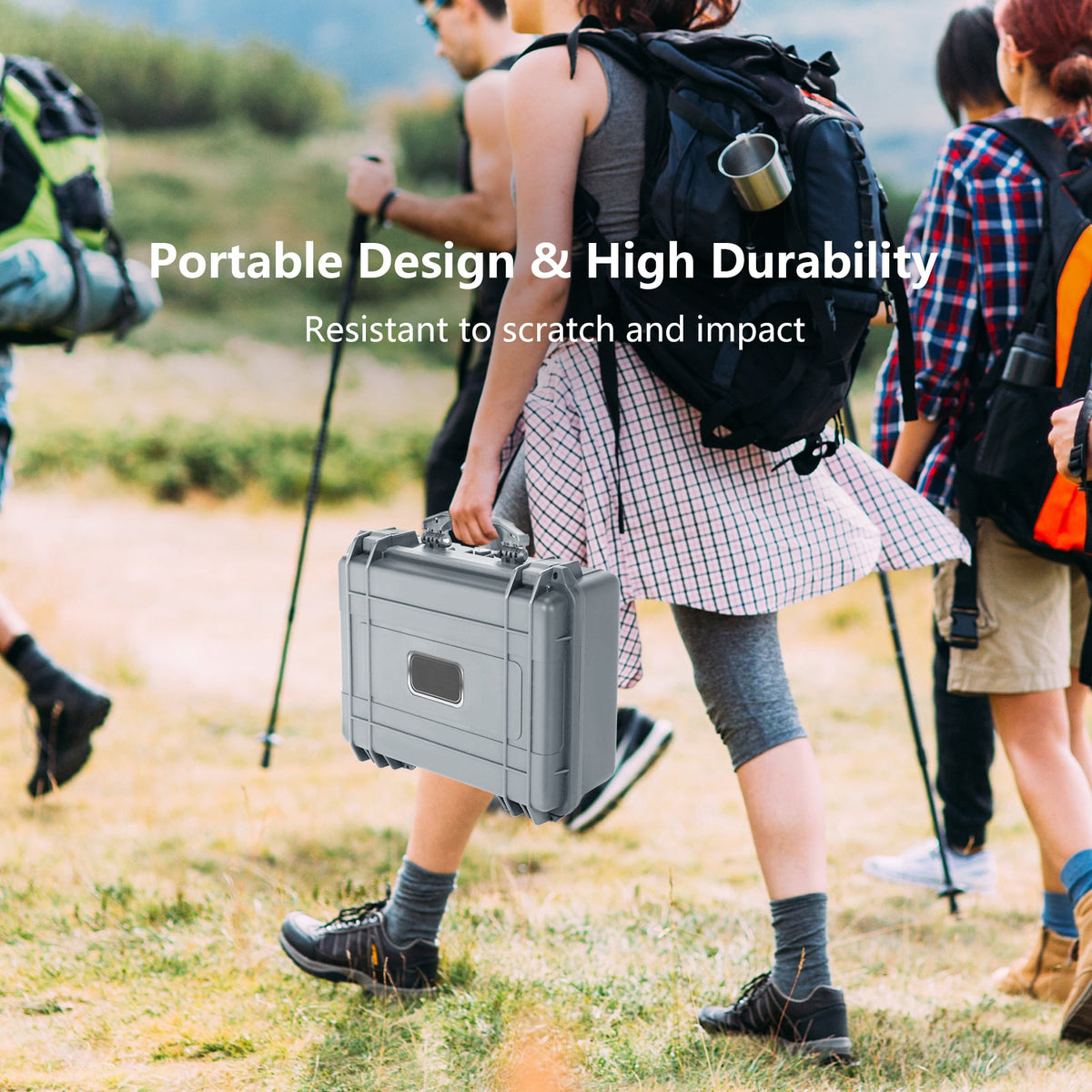 The camping case being carried by a person walking through a grassy field