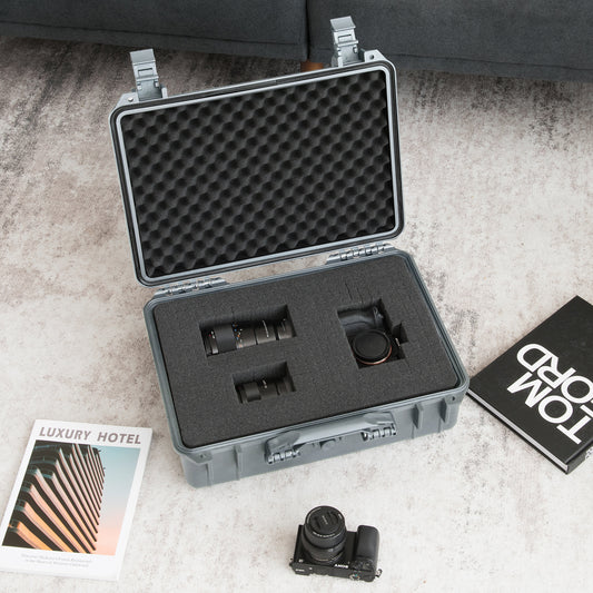 The camping case is shown with a camera and lenses inside