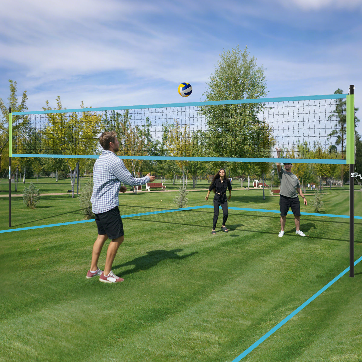 the volleyball net system installed on a green lawn with boundary lines marked out