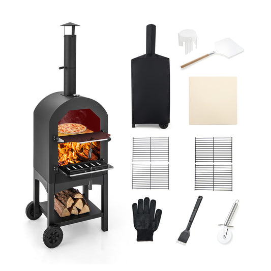 Portable Pizza Oven shown with a burning fire, a pizza inside and all the included tools and cover