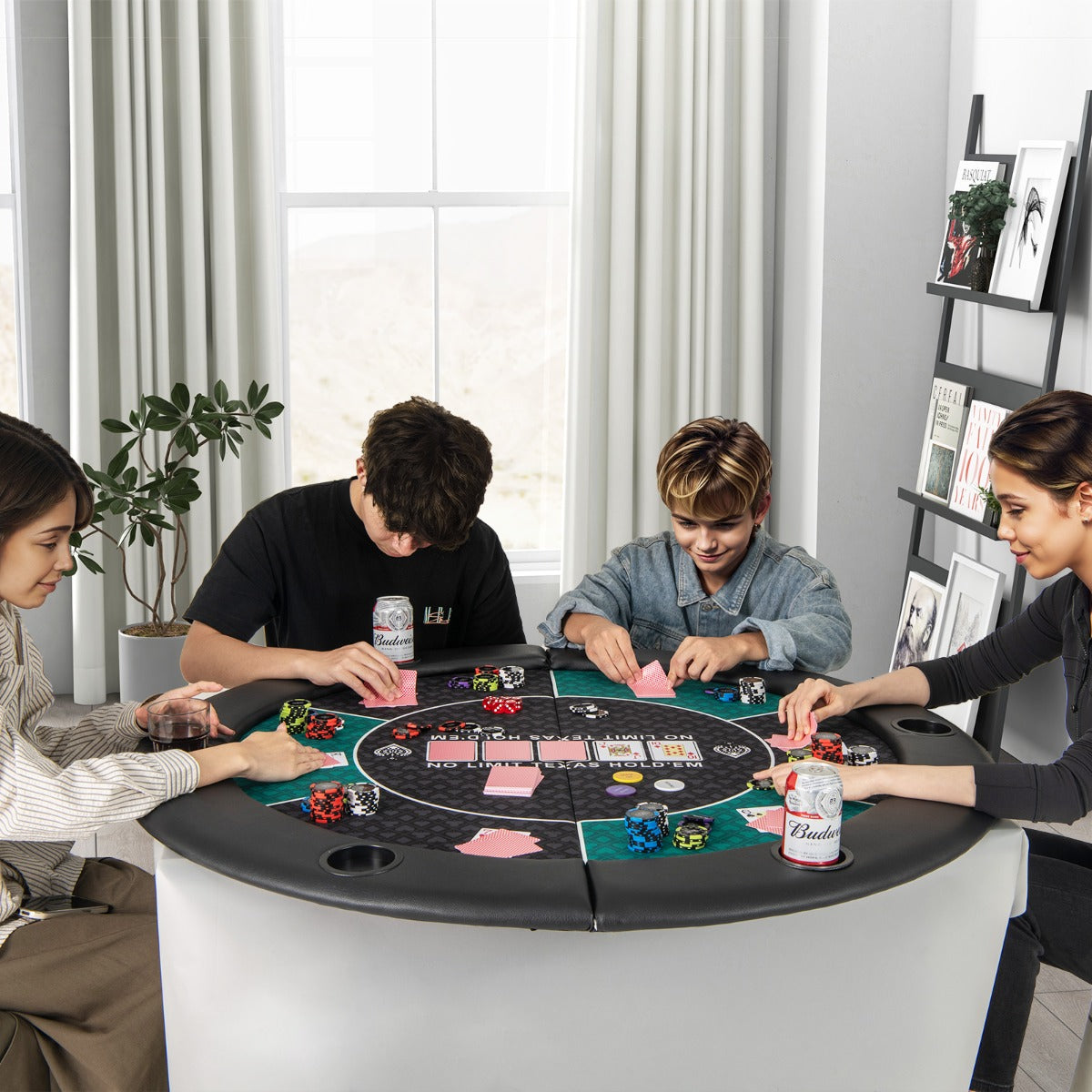The round blackjack board game mat in use with four people playing cards and chips around a table