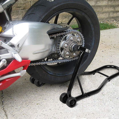 The black motorcycle stand lifting the rear wheel of a sport bike on a paved surface