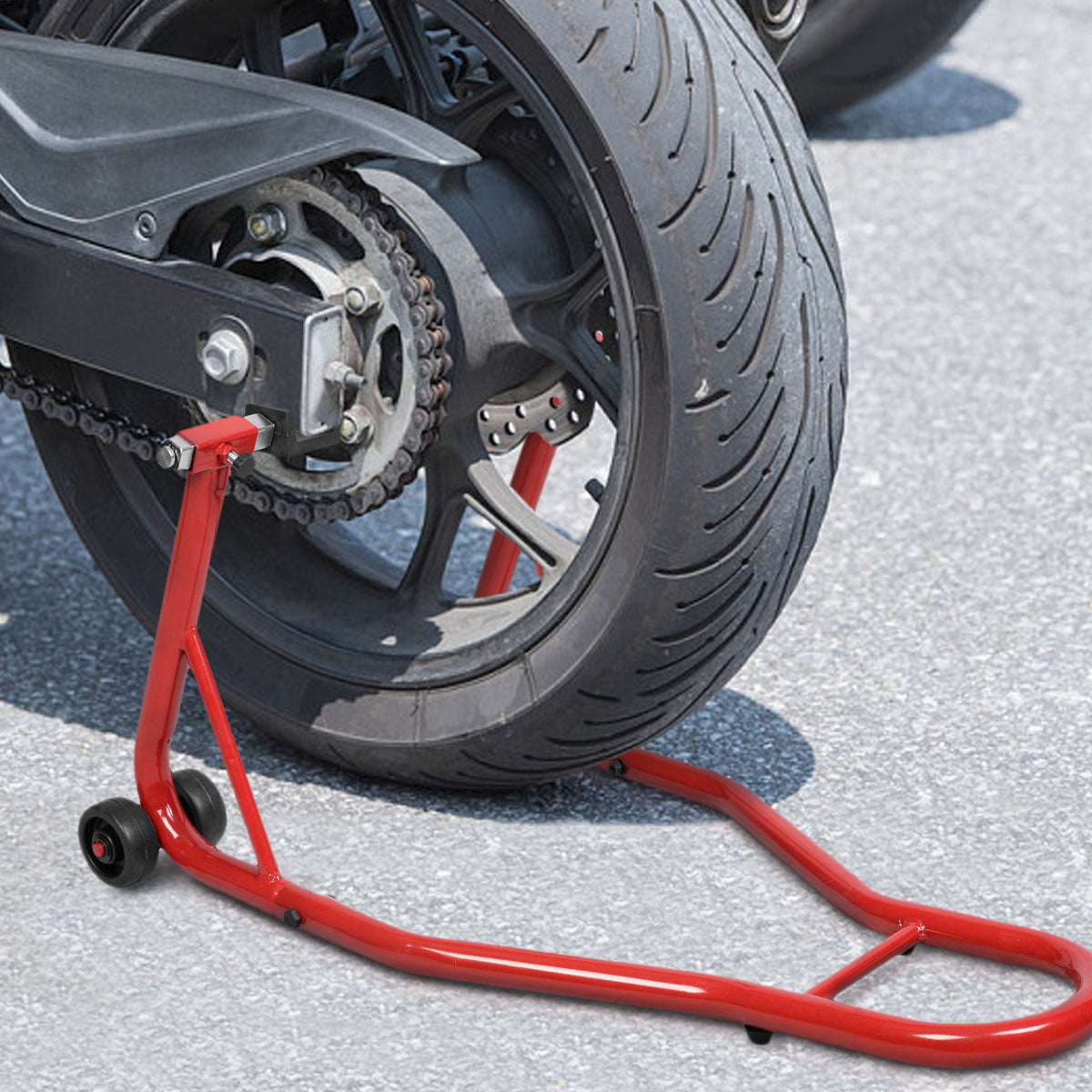 The red motorcycle stand lifting the rear wheel of a sport bike