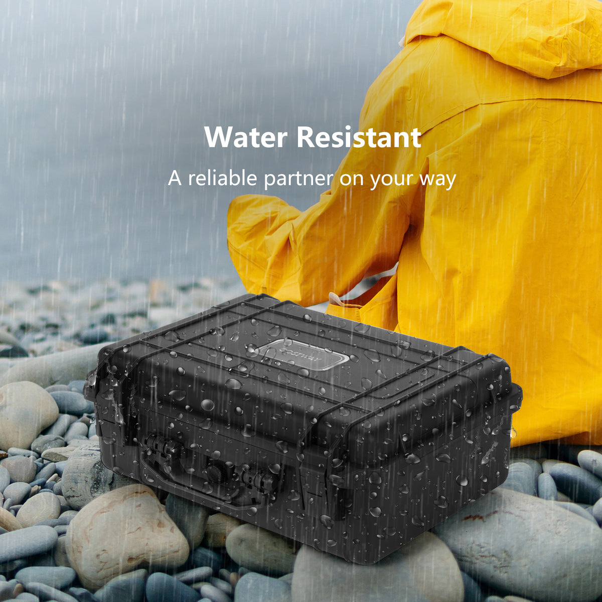 The hard case sitting on a rocky beach with water splashing