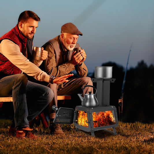 The portable wood burning stove with a kettle and pot on top while burning logs in the firebox