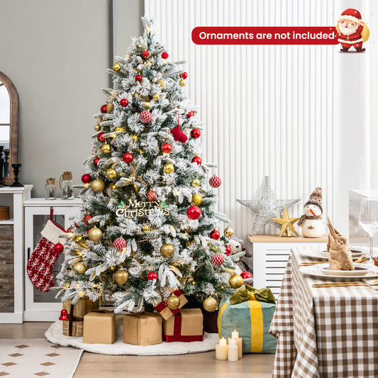 The decorated christmas tree standing in a living room with gifts placed underneath