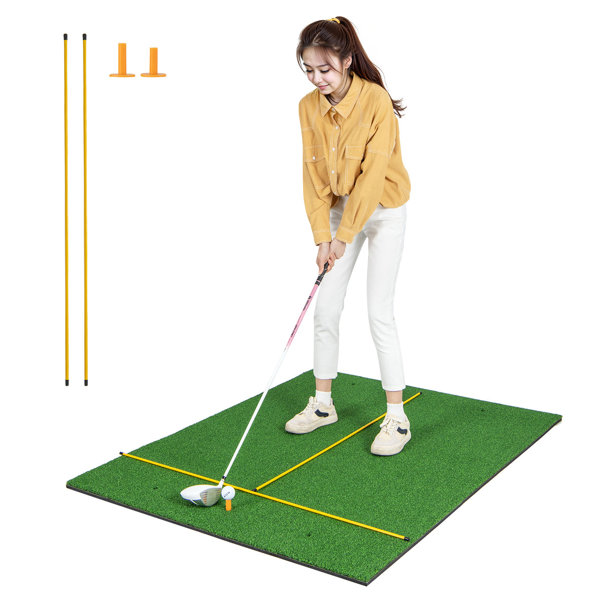 The golf practice mat with a woman standing on it while holding a golf club