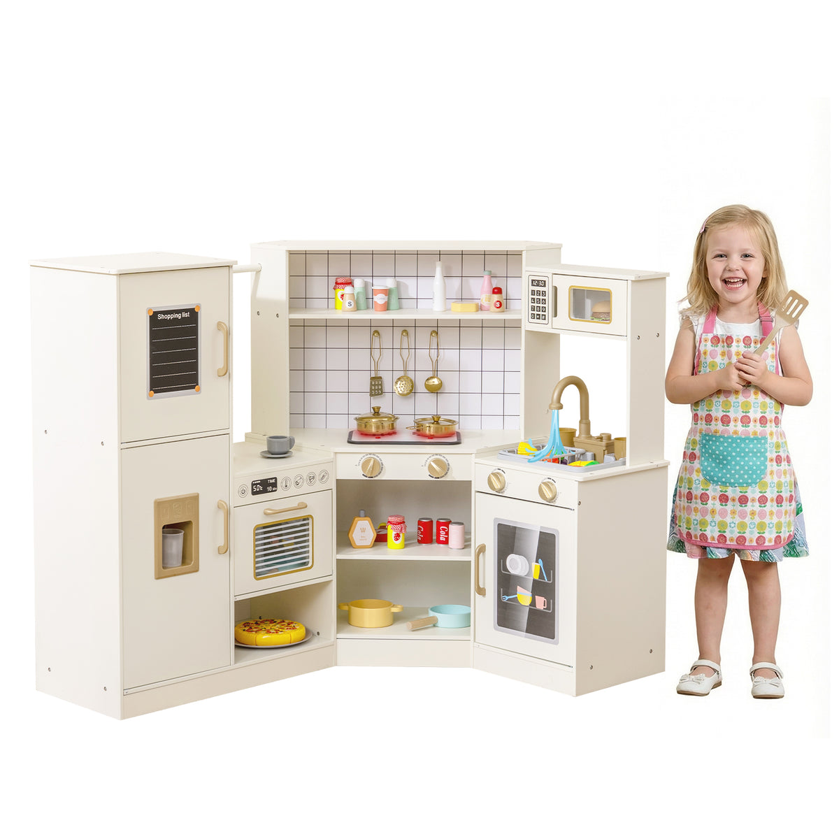 The play kitchen set next to a young girl wearing a colourful apron and holding a spatula