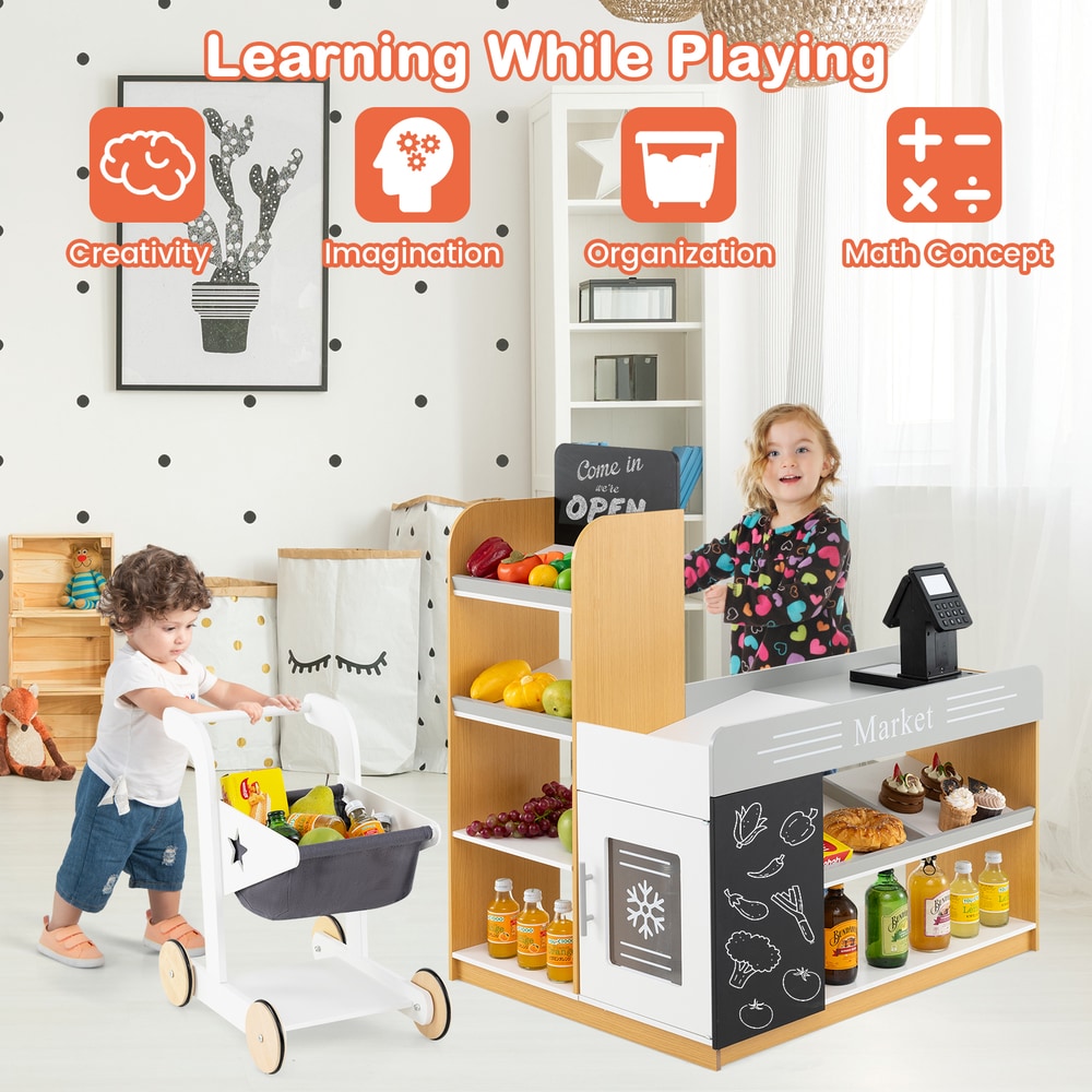 Children playing with the toy grocery store and shopping cart