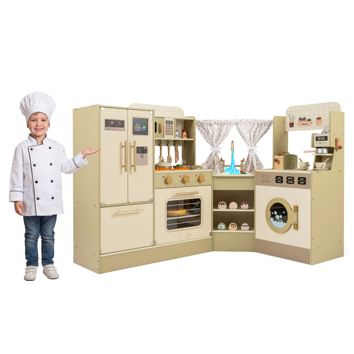 A young boy in a chef's hat stands next to the green pretend play kitchen playset