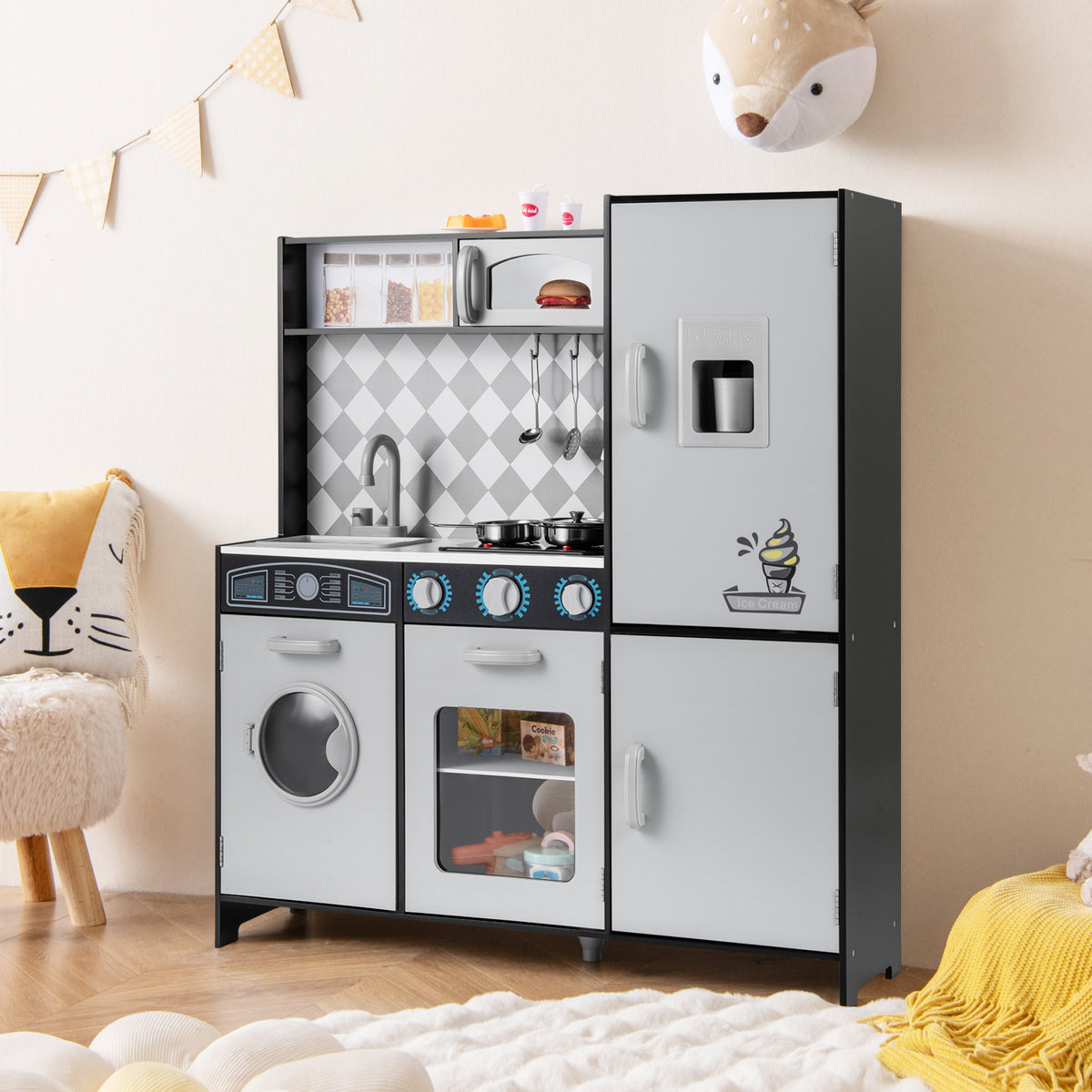 The play kitchen set placed in a child's bedroom with soft decor and a diamond pattern backsplash
