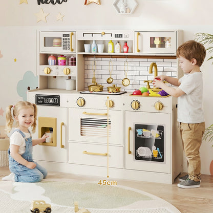 Two children are interacting with the pretend kitchen set, one pointing to the hob