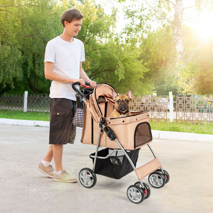 A man pushing the beige pet stroller with a dog inside on a path