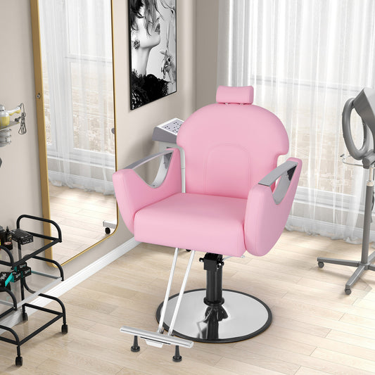 Pink reclining salon chair for hair stylists in a beauty salon setting with mirrors and equipment