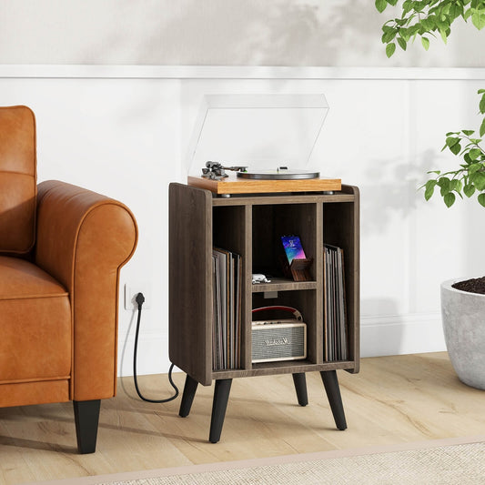 The record player stand in a living room, holding a record player and vinyl records