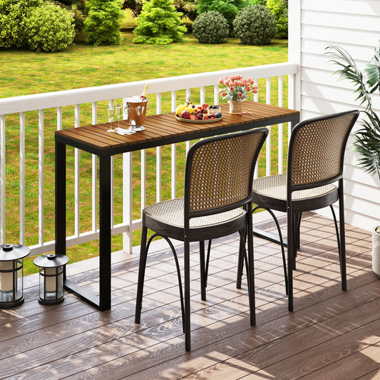 The patio table set up on a wooden balcony with two chairs and drinks for a relaxing outdoor break