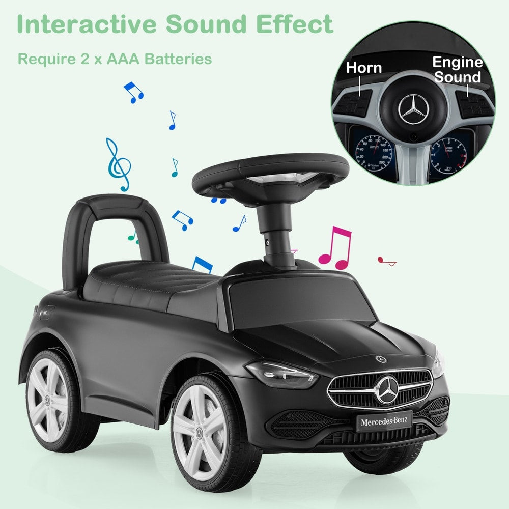 Black push and pedal ride on toy with sound effects and horn button on the steering wheel