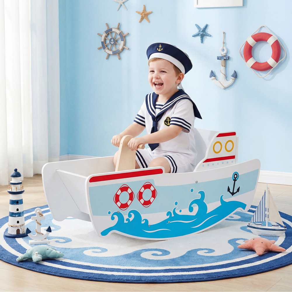 A happy child in a sailor outfit rides the wooden rocking ship toy with nautical theme