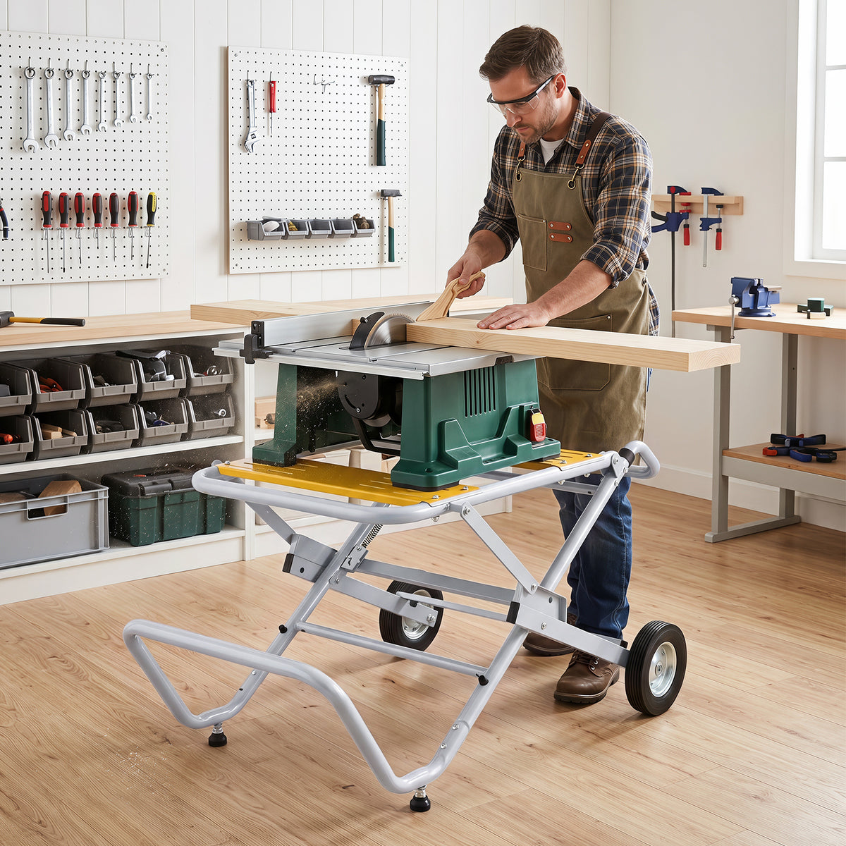 A man cuts wood on a table saw that is set up on the metal base in a workshop