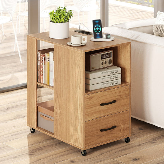 The rolling nightstand with books and a plant on top