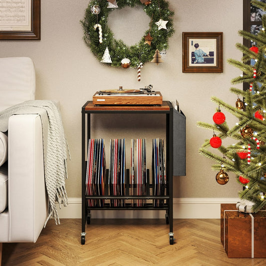The end table placed in a living room decorated for Christmas with a record player on top