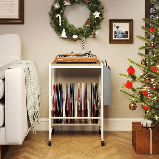 The side table placed in a living room decorated for Christmas with a record player on top