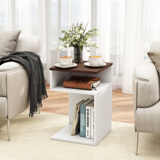 Walnut and white S-shaped side table in a living room setting with books and coffee cups