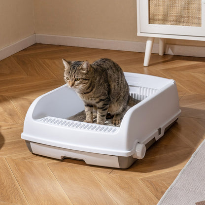 Open-top cat litter box with a cat standing inside on a wooden floor