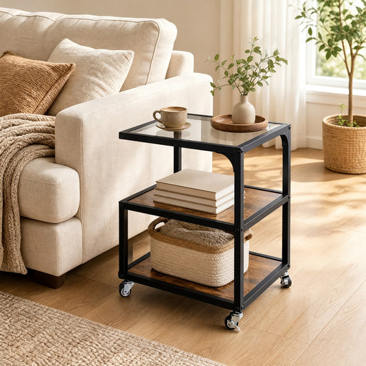 The rustic brown three-tier side table with glass top sits next to a sofa in a living room