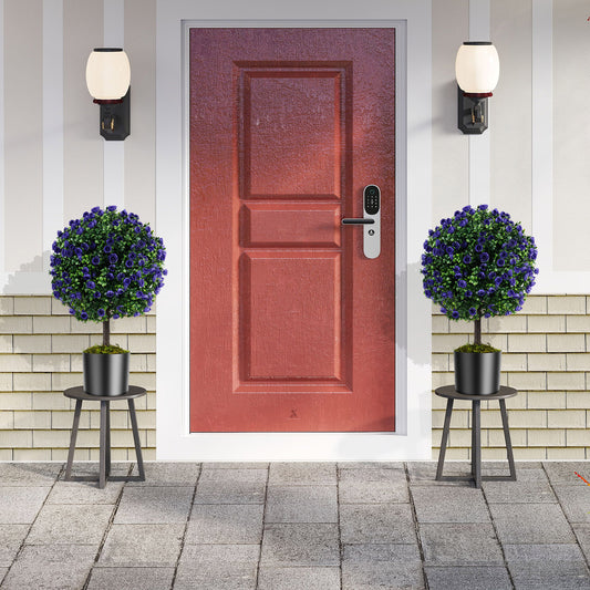 Two artificial purple rose topiary ball trees flanking a red front door
