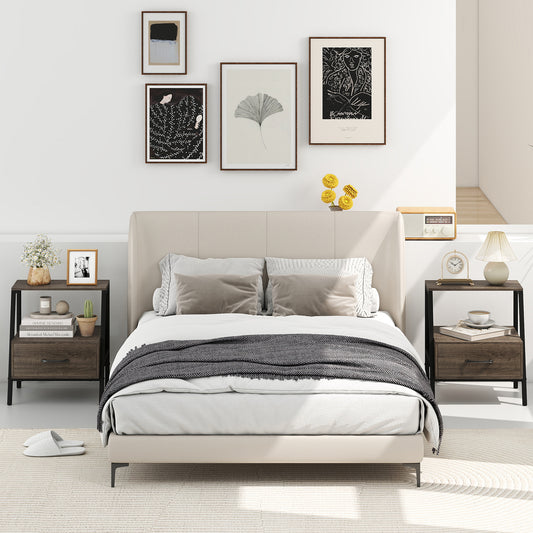 Two grey farmhouse nightstands in a bedroom setting next to a bed