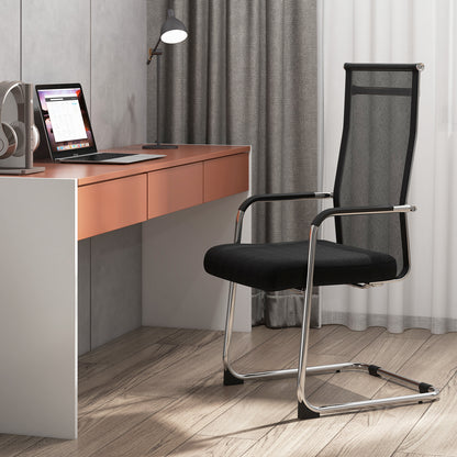 A black office guest chair with metal sled base and armrests in a home office