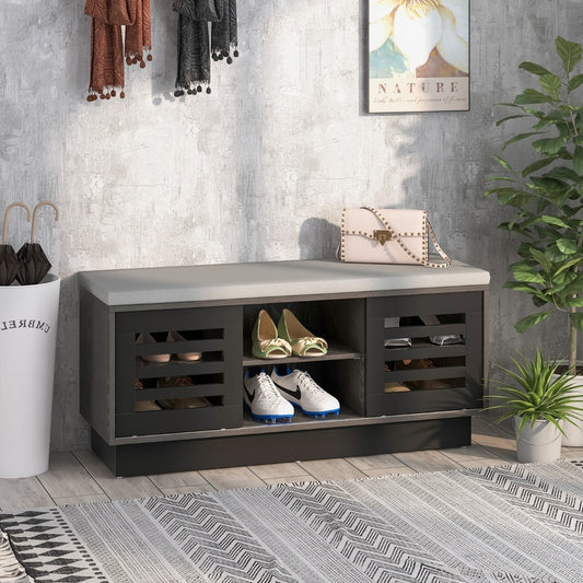 The shoe storage bench in a hallway with shoes and accessories