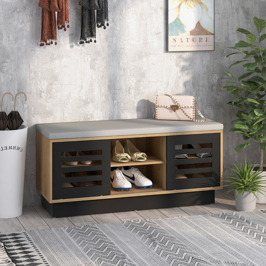 The shoe storage bench in a hallway with shoes and accessories displayed