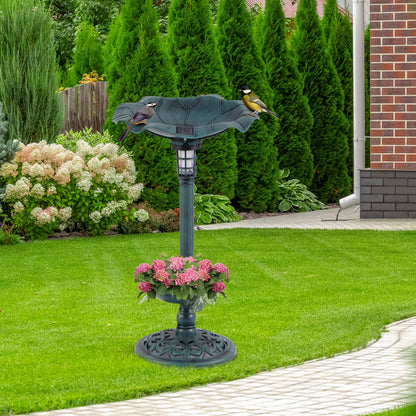 Antique bird bath and feeder set with two birds perched on the edge, placed on a green lawn