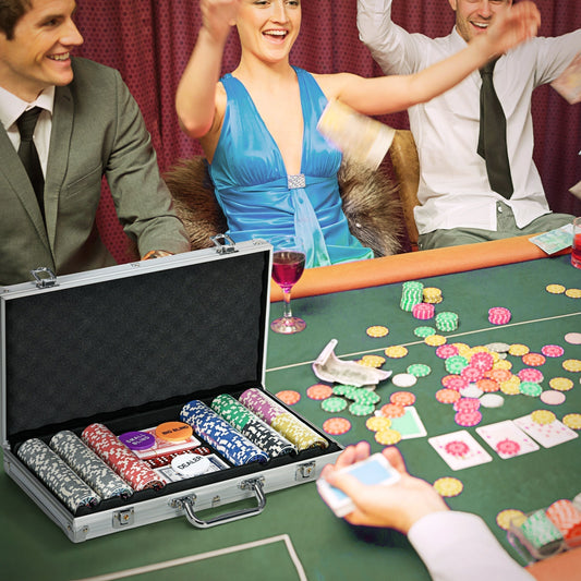 A poker set in use at a table with people playing cards and throwing money